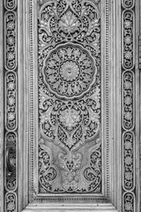 Wall Mural - Black and white fragment of an ancient carved wooden door. Ornate.