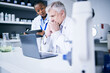 © Sharne T/peopleimages.com - Science, laptop and thinking in a laboratory for problem solving, medical research or results. Serious man and woman scientist or doctor with tech for scientific innovation, planning or teamwork