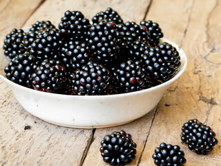 Wall Mural - blackberry in bowl on country table. Made with generative ai