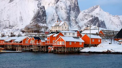 Wall Mural - cold morning view of popular tourist destination - lofoten islands. red houses on the shore of norwe