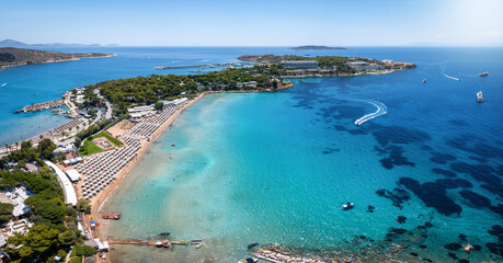 Wall Mural - Aerial view of the beautiful beach of Astir at the bay of Vouliagmeni, Athens, with turquoise and emerald sea