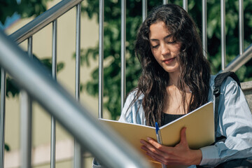 Wall Mural - teenage student with backpack and books at university