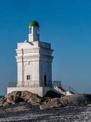 Sticker - Shelley Point lighthouse on a rocky beach on a sunny day in South Africa