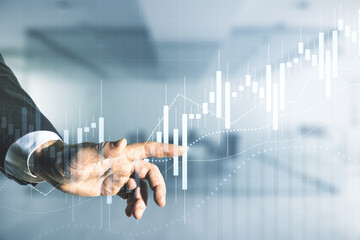 Wall Mural - Multi exposure of businessman hand presses on virtual creative financial chart hologram on blurred office background, research and analytics concept