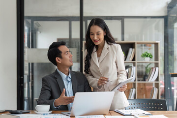 Wall Mural - Two happy business women and man, office employees work in office, share creative ideas, feel satisfied with corporation, engaged in teamwork. Negotiation, business