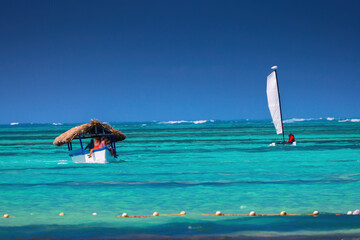 Wall Mural - sailing boat on the water of Caribbean sea on hot summer day. Dominican Republic