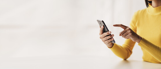 Wall Mural - portrait of a young woman holding a mobile phone to use social media on a smartphone. communicate vi