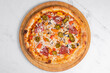 © Tural - Pizza with sausage, pickled pepper and grated cheese