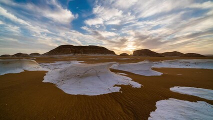 Wall Mural - Timelapse of chalk rocks in the White Desert at sunset. Egypt, Baharia