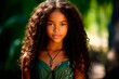 © Zireael - Close-up portrait of a teenage Latino girl with long curly hair on a background of greenery. AI generation