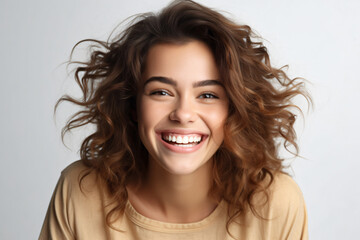 happy woman smiles at camera, isolated over white background.