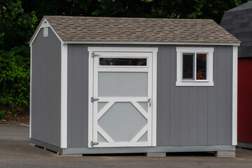 Wall Mural - cute small wooden storage shed, with windows and shingle roof nice entrance door design