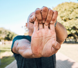 Stretching hands, man and nature for fitness, running start or cardio preparation. Ready, training and a male runner or athlete with a morning warm up in a park for exercise and sports performance