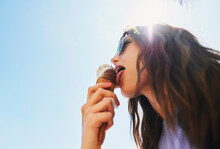 Summer, Below And A Woman With Ice Cream On A Blue Sky For Freedom, Travel And Sweet Food. Sun, Holiday And A Young Girl With A Dessert During A Vacation In Spring Or A Eating Gelato And Thinking