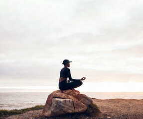 lotus pose, woman and yoga at the beach, fitness and meditation with spiritual wellness in nature. e