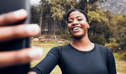 Wall Mural - Fitness, black woman taking a selfie and in forest for social media motivation. Workout sportswear or training, exercise or health wellness and African female athlete happy in woods for running