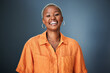 © Malik/peopleimages.com - Smile, laugh and portrait of black woman laughing in studio at silly, joke or funny against a gradient grey background. Happy, laugh and face of African female with positive attitude or good vibes