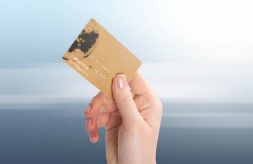 Wall Mural - Female hand with plastic blank bank card