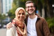 © Adriana - Happy Middle eastern smiling couple posing in a city street
