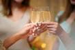 © mojo_cp - Group of friends celebrating with champagne  Close up on hands.