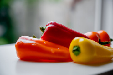 Wall Mural - Snack peppers. Colorful juicy vegetables. Mix of yellow orange and red peppers. Chilly and sweet peppers. Bulgarian pepper. Fresh bell peppers.