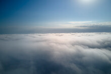 Aerial View From High Altitude Of Earth Covered With Puffy Rainy Clouds Forming Before Rainstorm