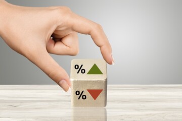 Poster - Symbol of interest rate. wooden cube with arrow