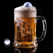 © ESME BIANCA - Frothy beer mug on a black background with golf ball ice cube