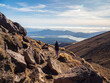 © Tetra Images - New Zealand, Waikato, Tongariro National Park, Hiker hiking