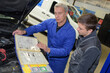 © auremar - apprentice mechanic working in auto repair shop