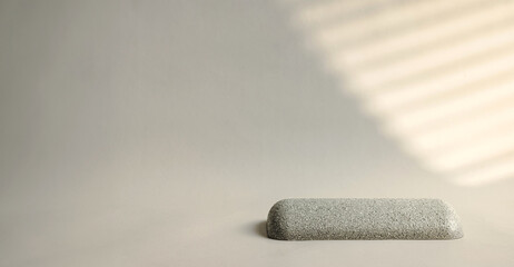 Poster - Minimal round stone product display with sunlight from window on cream color background