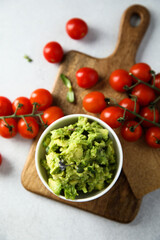 Canvas Print - Homemade avocado dip with ripe tomatoes