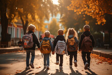 A Group Of First Graders Go To Enrollment On Their First Day At School. Education And Start Into A New Future. Wallpaper And Poster For News Articles.