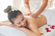 Asia beautiful  woman enjoying a salt scrub massage at the health spa in Thailand