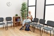 © Krakenimages.com - Young blonde woman using smartphone sitting on chair at waiting room