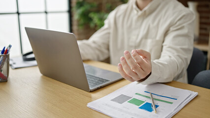 Poster - Young hispanic man business worker doing yoga exercise at office