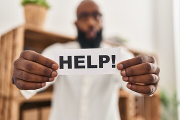 Poster - African american man holding help reminder making fish face with mouth and squinting eyes, crazy and comical.