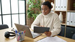 © Krakenimages.com - African american woman business worker using touchpad and laptop at office