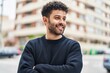 © Krakenimages.com - Young arab man smiling confident standing with arms crossed gesture at street