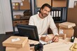 © Krakenimages.com - Middle age man ecommerce business worker using laptop writing on document at office