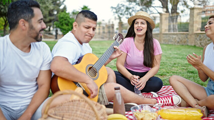 Sticker - Group of people playing guitar having picnic at park