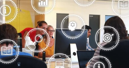 Poster - Animation of icons over happy caucasian female coworkers looking into computer and giving high five