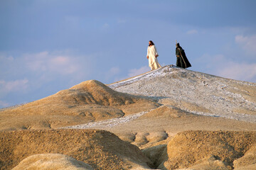 Wall Mural - Jesus and Devil on a hill in a Judean desert. Biblical concept.