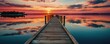 Wooden pier on the lake at sunset. Beautiful summer landscape