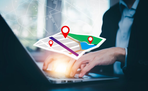 Man using Smartphone with virtual world and model map with location point, GPS app, icon Travel maps and find places in the online system, all screen graphics are generated, Searching for travel.