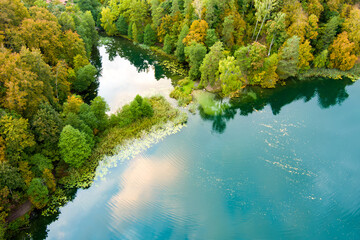  Aerial view of beautiful Balsys lake, one of six Green Lakes, located in Verkiai Regional Park. Birds eye view of scenic emerald lake surrounded by pine forests. Vilnius, Lithuania.