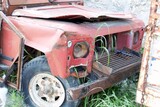 Fototapeta Na sufit - Ravaged Red Off-Road Vehicle: A Glimpse of Destruction