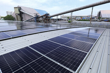 Canvas Print - Solar PV on Factory Roof with Triangle Warehouse and High Conveyor System Background