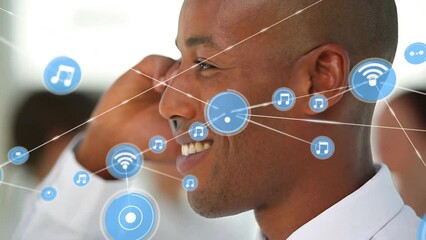 Poster - Animation of network of digital icons against african american businessman talking on smartphone