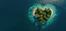 Aerial Drone Shot Of A Heart Shaped Tropical Palm Island In The Ocean With Lots Of Negative Space.